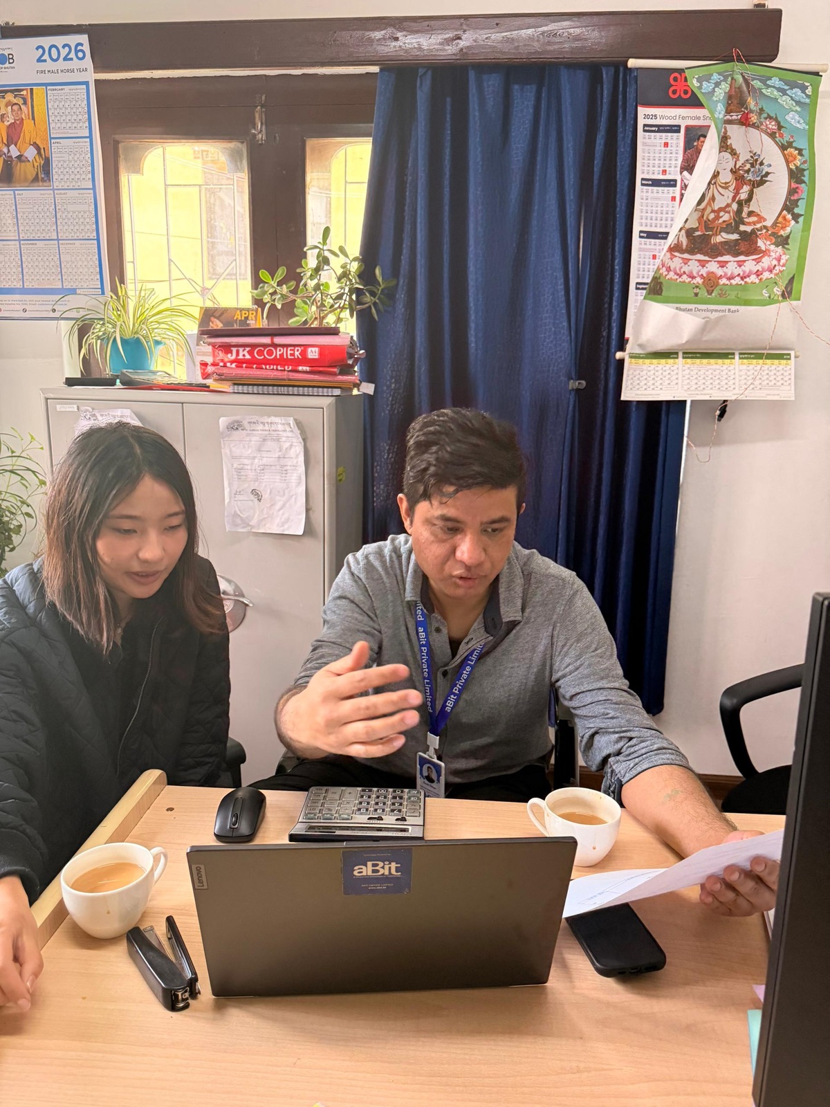 Gangri Tours staff working through a booking on aBit Invoice.
